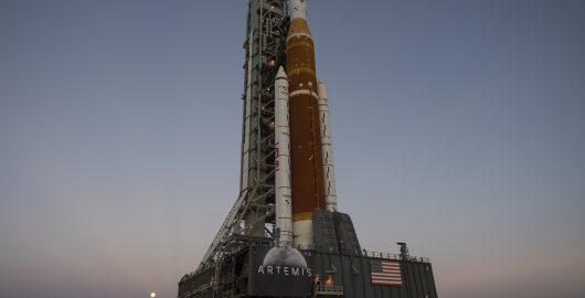 The Moon is seen rising behind NASA’s Space Launch System (SLS) rocket with the Orion spacecraft aboard atop a mobile launcher as it rolls out to Launch Complex 39B for the first time, Thursday, March 17, 2022, at NASA’s Kennedy Space Center in Florida. Ahead of NASA’s Artemis I flight test, the fully stacked and integrated SLS rocket and Orion spacecraft will undergo a wet dress rehearsal at Launch Complex 39B to verify systems and practice countdown procedures for the first launch. Photo Credit: (NASA/Aubrey Gemignani)